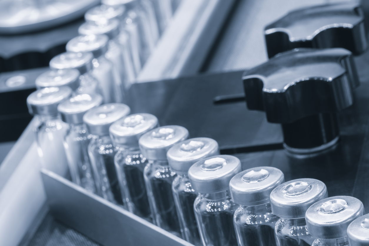 Pre-sterilized vials with seals on a manufacturing line